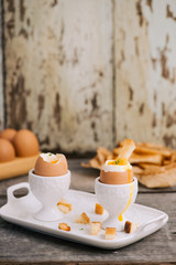 boiled eggs for breakfast on a old wooden table