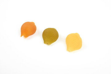three colors conchiglie paste isolated on white background
