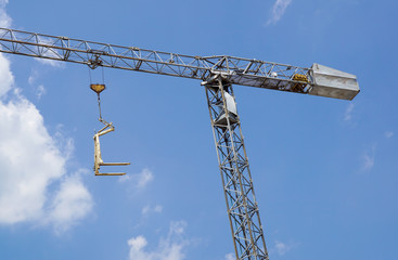 Crane lifting Pallet .Blue sky on background