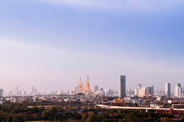 Fototapeta na wymiar Bangkok skyline cityscape and King Bhumibol bridge or Industrial ring road bridge.
