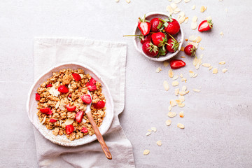 Granola Cereal bar with Strawberries on the Gray Background. Muesli  Breakfast. Healthy Food sweet dessert snack. Diet Nutrition Concept. Top View. Vegetarian food.Flat Lay.Copy space