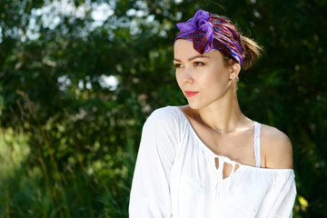 Young beautiful girl posing in nature