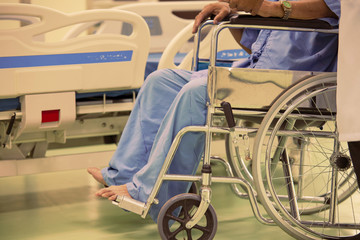Fototapeta na wymiar Close up Asian patient in wheelchair sitting in hospital.
