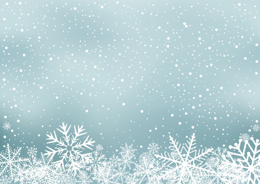 Winter holiday background with snow. Frosty close-up wintry snowflakes. Ice shape pattern. Christmas decoration backdrop