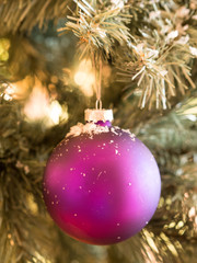 Christmas ball on fir tree outdoors