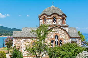 Olympiada, Greece - August 18, 2018: St. Nicholas church at the beach of the town Olympiada in Chalkidiki in Greece