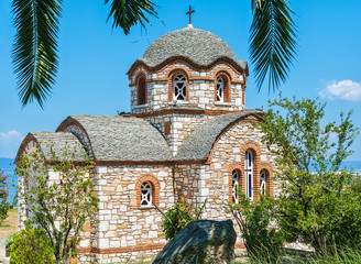 Naklejka premium Olympiada, Greece - August 18, 2018: St. Nicholas church at the beach of the town Olympiada in Chalkidiki in Greece