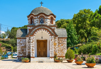 Naklejka premium Olympiada, Greece - August 18, 2018: St. Nicholas church at the beach of the town Olympiada in Chalkidiki in Greece