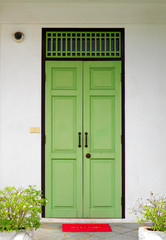 Closed green wooden doors