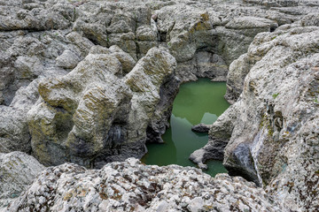 Daytime spring view taken at the amazing Devil's Canyon natural phenomenon in Bulgaria, also known as Sheytan Dere near Studen Kladenetz reservoir in Rhodope Mountain. Wonderful green waters