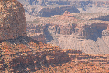 Closeup view on red rocks of Grand Canyon on sunny day