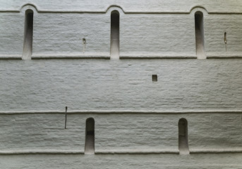 View of the wall of an old building. Part of the wall with windows. White background.
