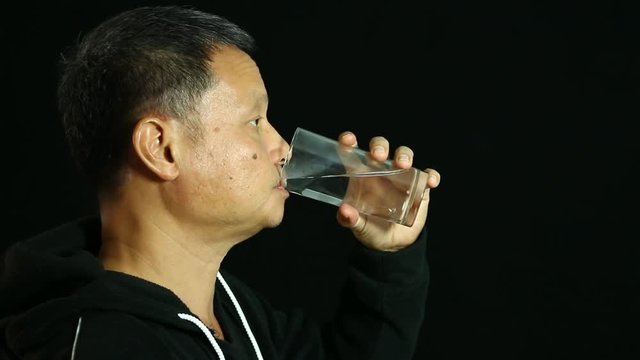 Thai man drinking water