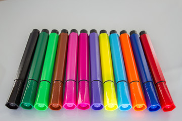 Colored pens set on white background