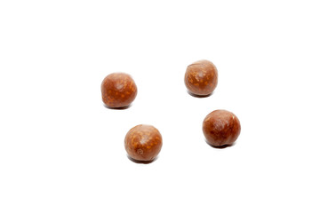 close up of organic macadamia nut on white background