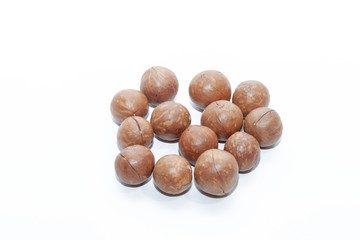 close up of organic macadamia nut on white background