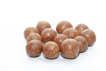 close up of organic macadamia nut on white background