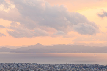View of Athens, Aegina island and peloponnese from Lycabettus hill at sunset, Greece. 
