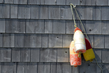 Old Lobster Floats Hanging On A Building Decoration