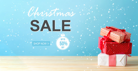 Christmas sale message with Christmas gift boxes with red ribbons