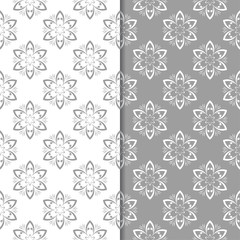 White and gray floral backgrounds. Set of seamless patterns