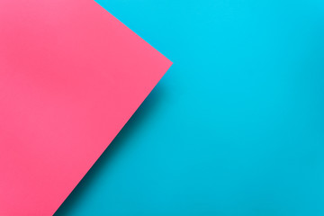 Blue and pink pastel color papered background. Volume geometric flat lay. Top view. Copy space