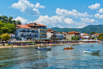 Fototapeta premium Olympiada, Greece - August 18, 2018: Beach of Olimpiada town at Chalkidiki, Greece