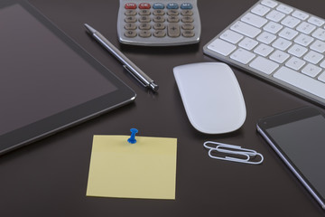 Office desk with digital tablet and smartphone