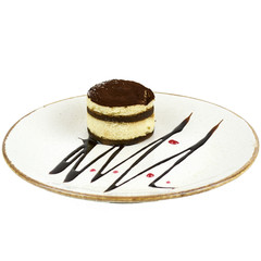 piece of chocolate cake on a plate isolated on white