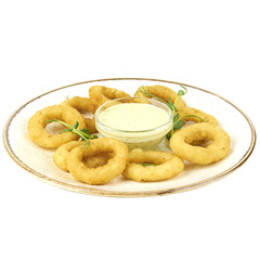 fried squid rings on plate with tomato sauce