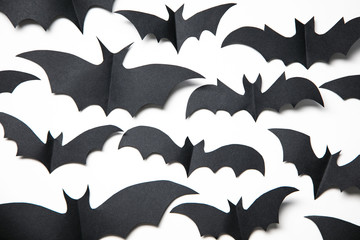 Halloween paper bat decorations on a white background.