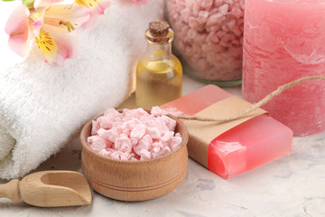 Spa composition with sea salt, aroma oils and handmade soap. spa concept. on a light background.