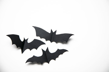 Halloween paper bat decorations on a white background.