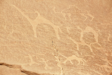 Prehistoric rock painting in the sand desert Wadi Rum, Jordan.