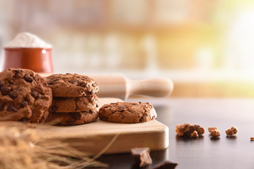 Homemade biscuits with chocolate chips on black table front