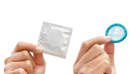 Man's hand holding condom isolated on a white background - clipping paths