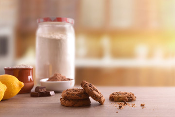 Homemade cookies with chocolate chips on wooden table front view