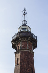 Fototapeta na wymiar An old lighthouse in the seaport in Gdansk. Poland
