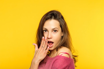 omg unbelievable shock amazement. dumbfounded woman covering open mouth with hand. portrait of a...