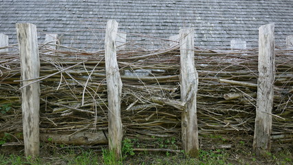 Wooden fence.Natural fence made of brushwood and twigs