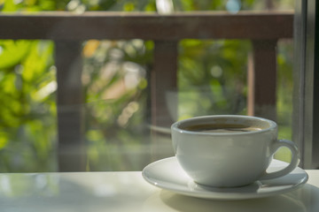 Coffee cup of hot  with  on wooden floor place for message.