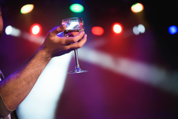Man offering champagne and flirting at party