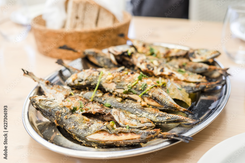 Wall mural Silver tray full of delicious fish mackerel known as carapau in Portugal