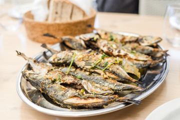 Silver tray full of delicious fish mackerel known as carapau in Portugal