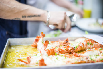 Baked tiger shrimps in a butter sauce with herbs