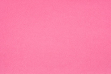 pink paper texture background. colored cardboard fibers and grain. empty space concept.