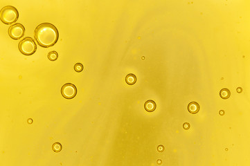 background air bubble out of yellow liquid