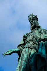 Statue of King Charles, Prague, on a blue sky background. Monument sculpture of the Czech King Charles 4