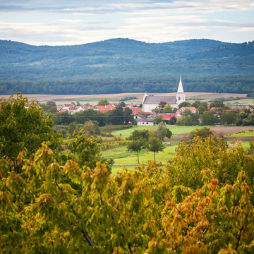 Village and Church in autumn landscape austria