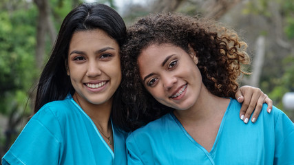 Young Female Hispanic Nurses And Friendship